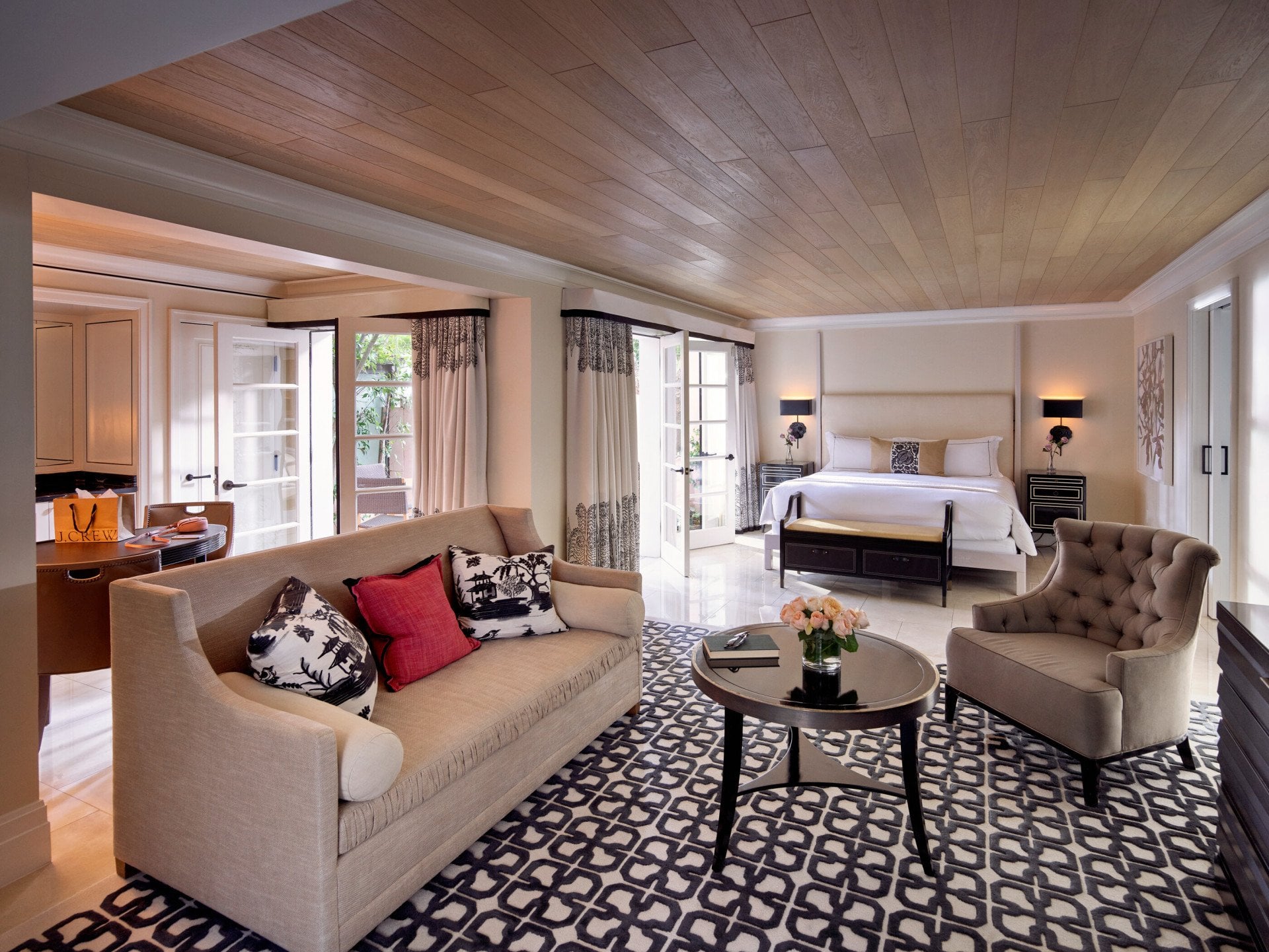 Sitting area and king sized bed Junior Pool Suite