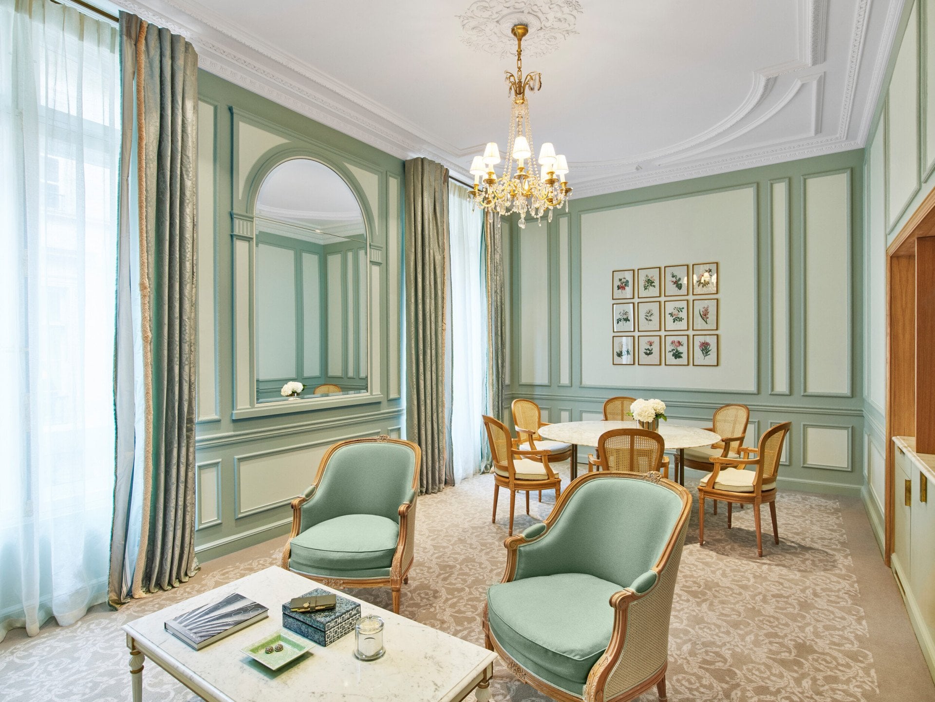 Living room of a superior suite in green tones at Le Meurice, Paris.