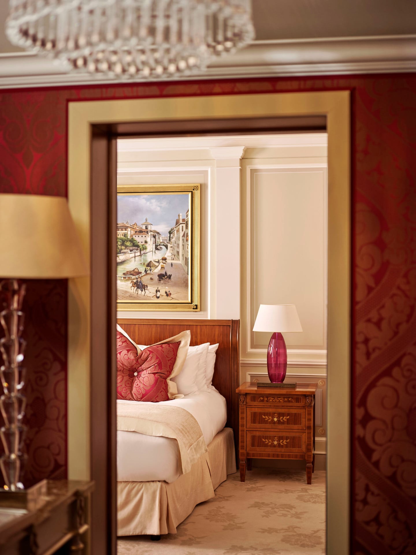 Principe Suite Bedroom Snippet showing part of the king size bed and the large painting above the headboard