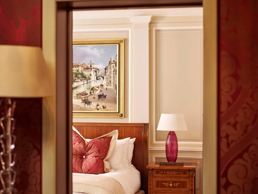 Principe Suite Bedroom Snippet showing part of the king size bed and the large painting above the headboard