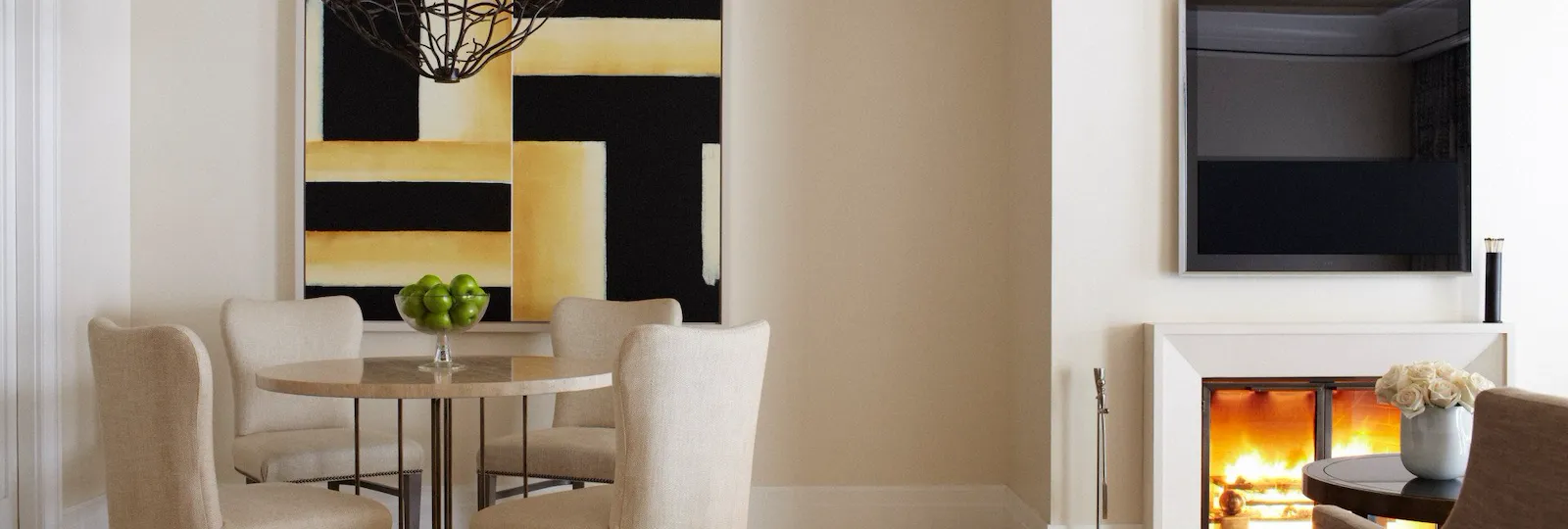 Dining table for four in the Stone Canyon suite with fireplace