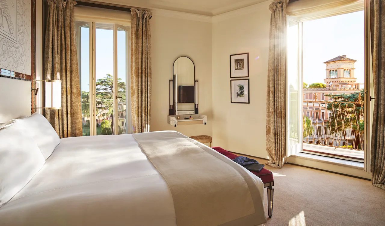 Bedroom of Villa Medici Presidential Suite with view of Villa Malta at Hotel Eden, Rome