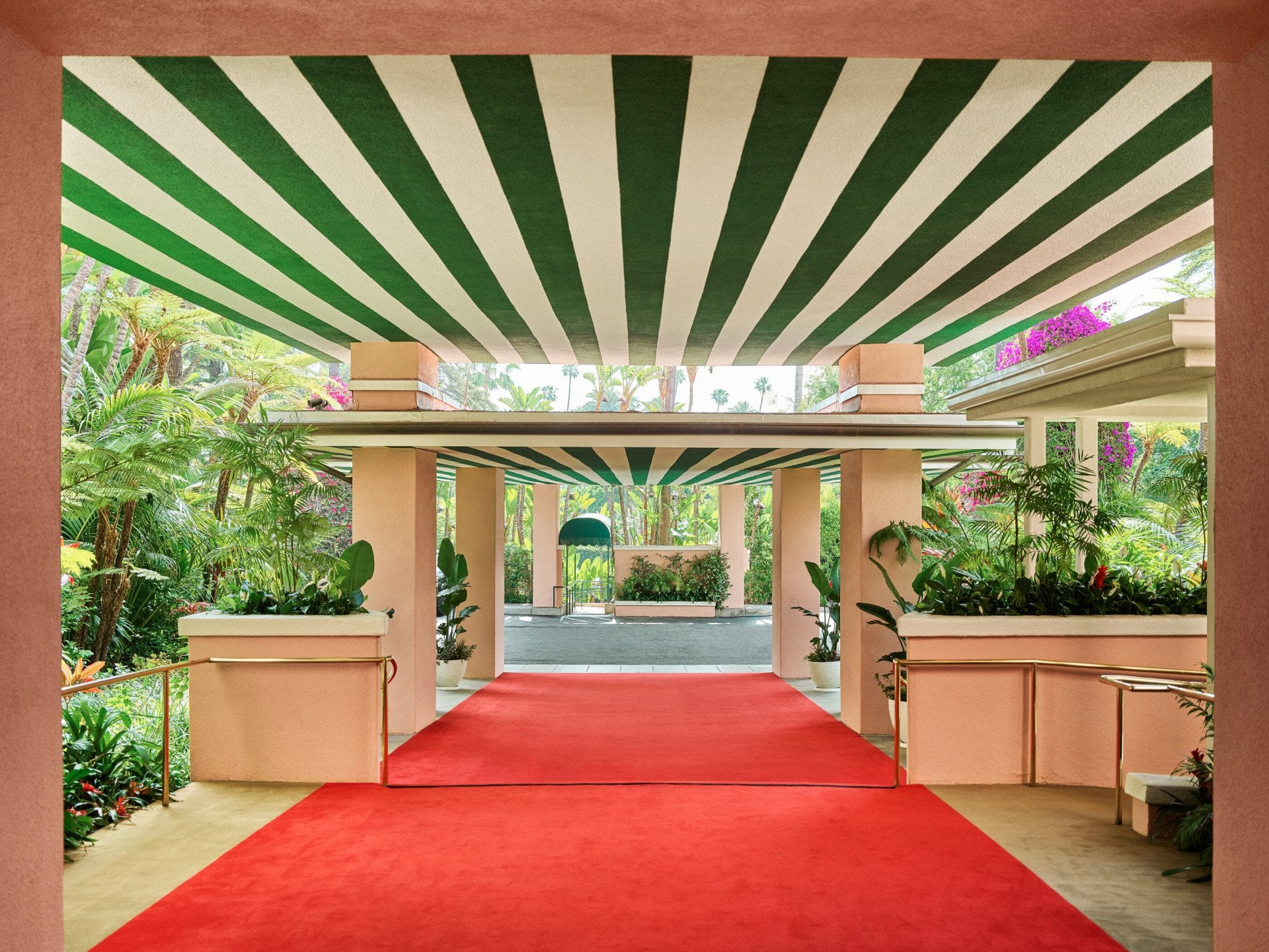Red carpet entrance to The Beverly Hills Hotel facing the valet parking direction. 