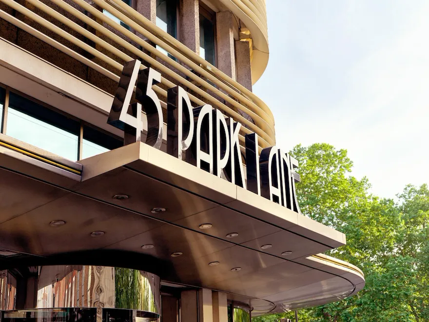 The exterior entrance of 45 Park Lane, London in daytime