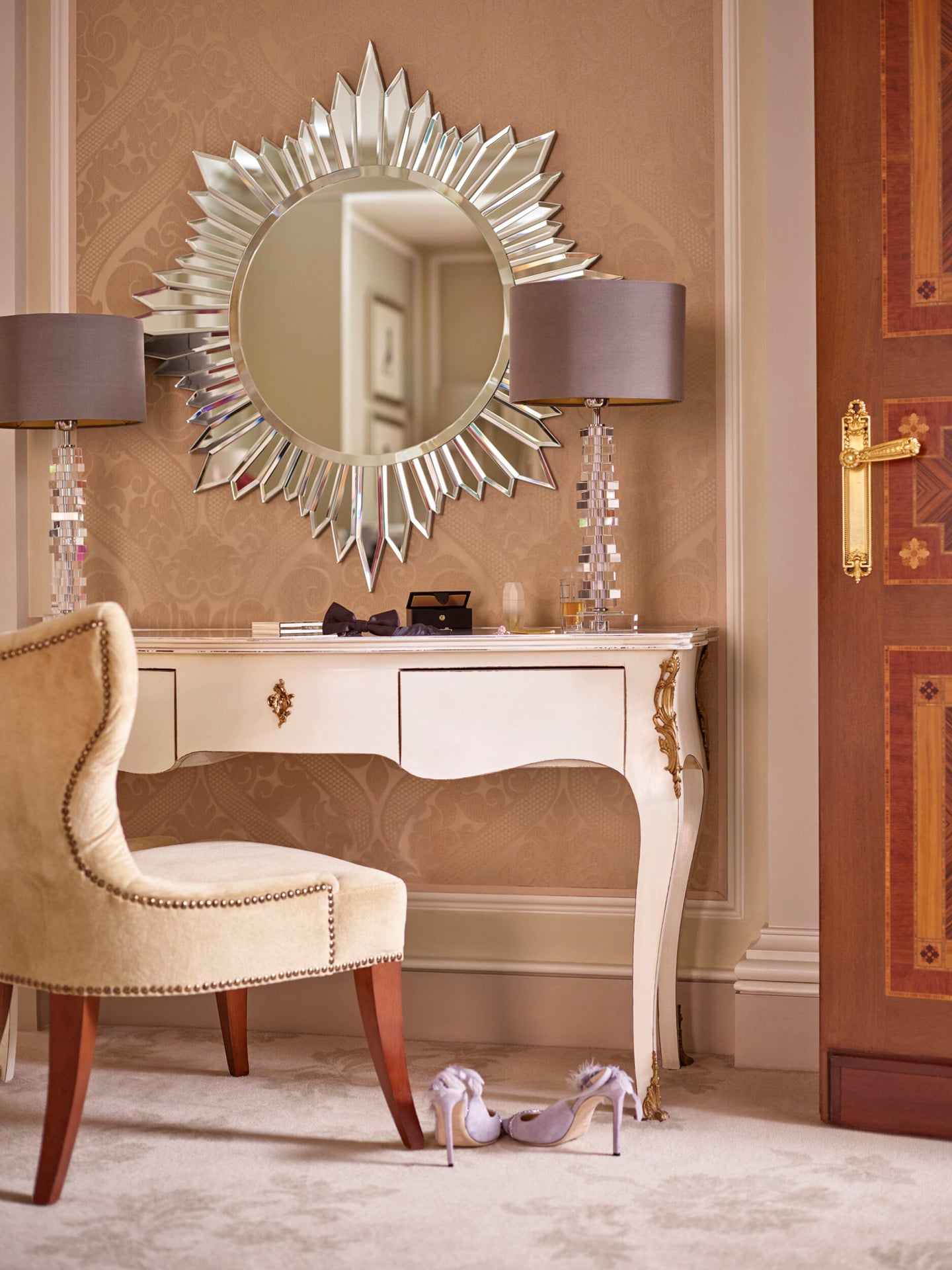 Principe Suite Detail showing a mirrored vanity table and a pair of lilac shoes on the floor