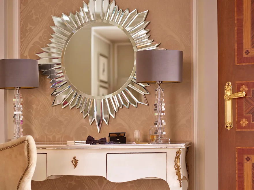 Principe Suite Detail showing a mirrored vanity table and a pair of lilac shoes on the floor