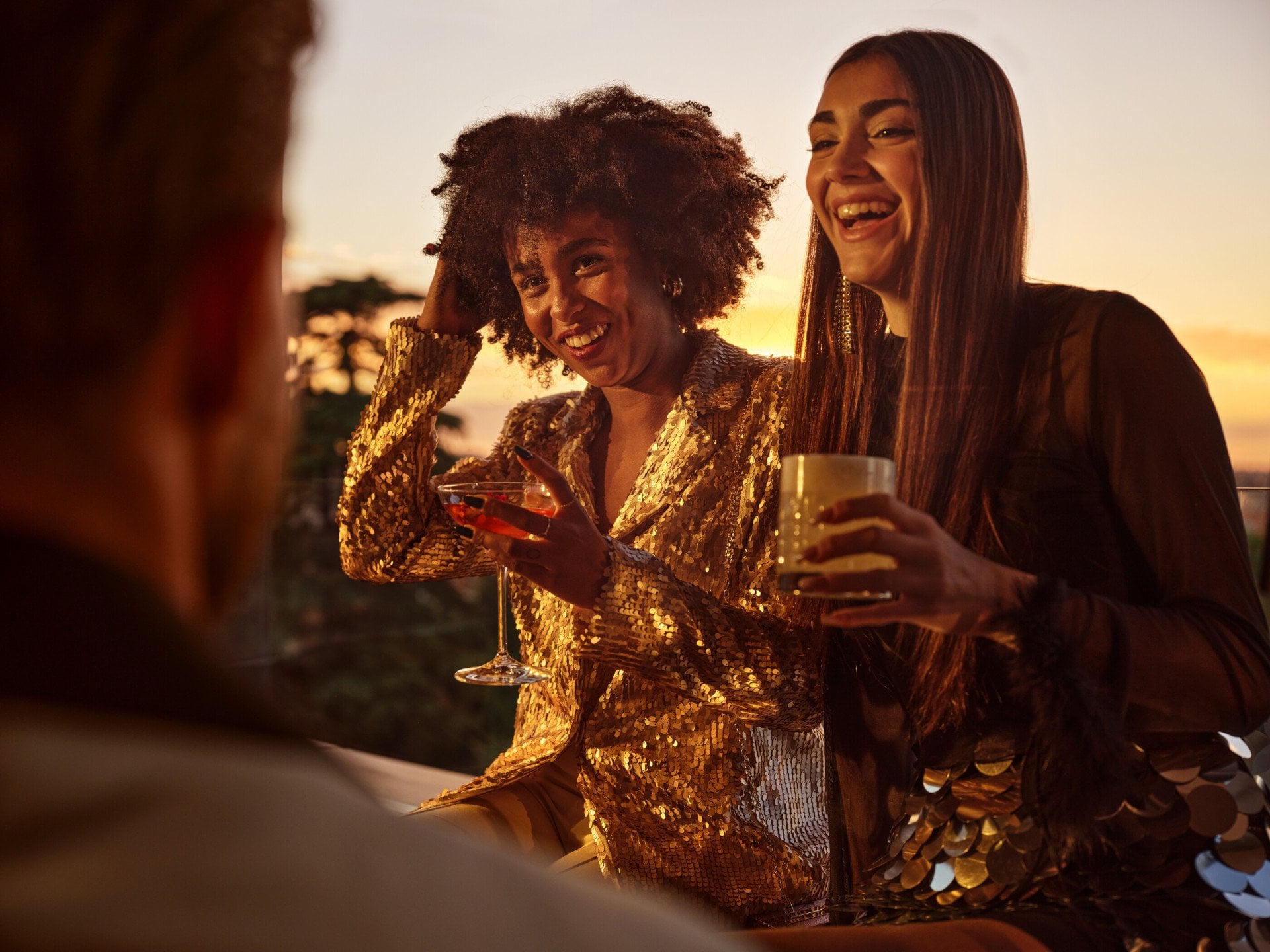 Portrait of smiling ladies having a drink at sunset, Il Giardino Bar, Hotel Eden