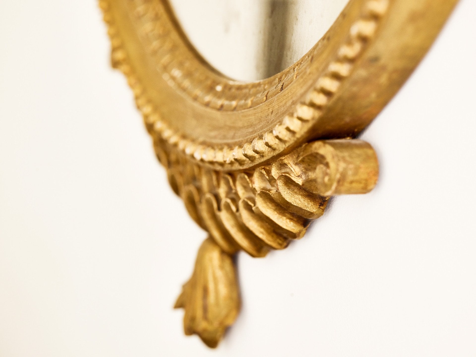 Detail of golden mirror frame inside Classic suite at Hotel Eden, Rome