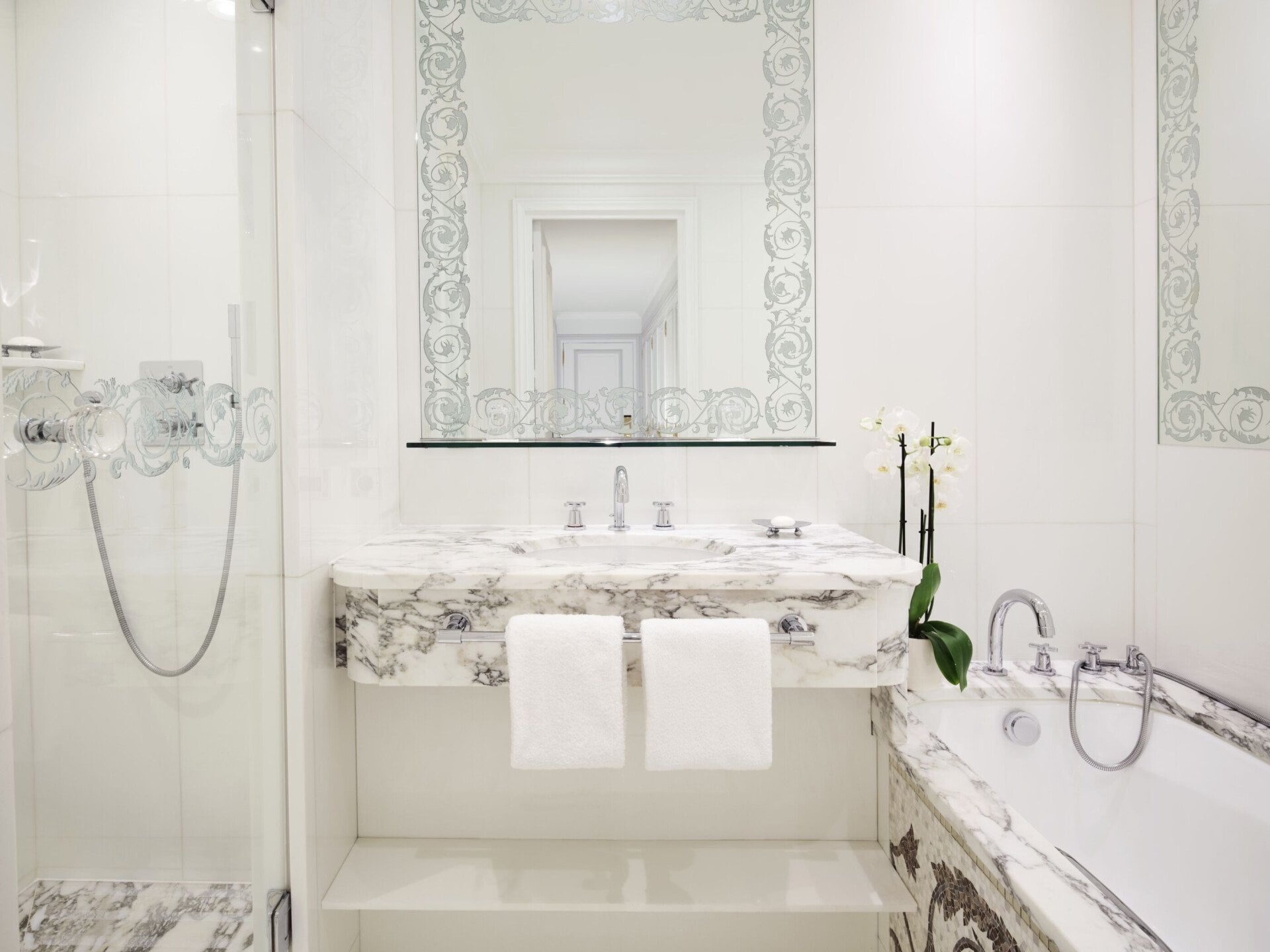 This is the bathroom of a single room #101 with a bath and shower.