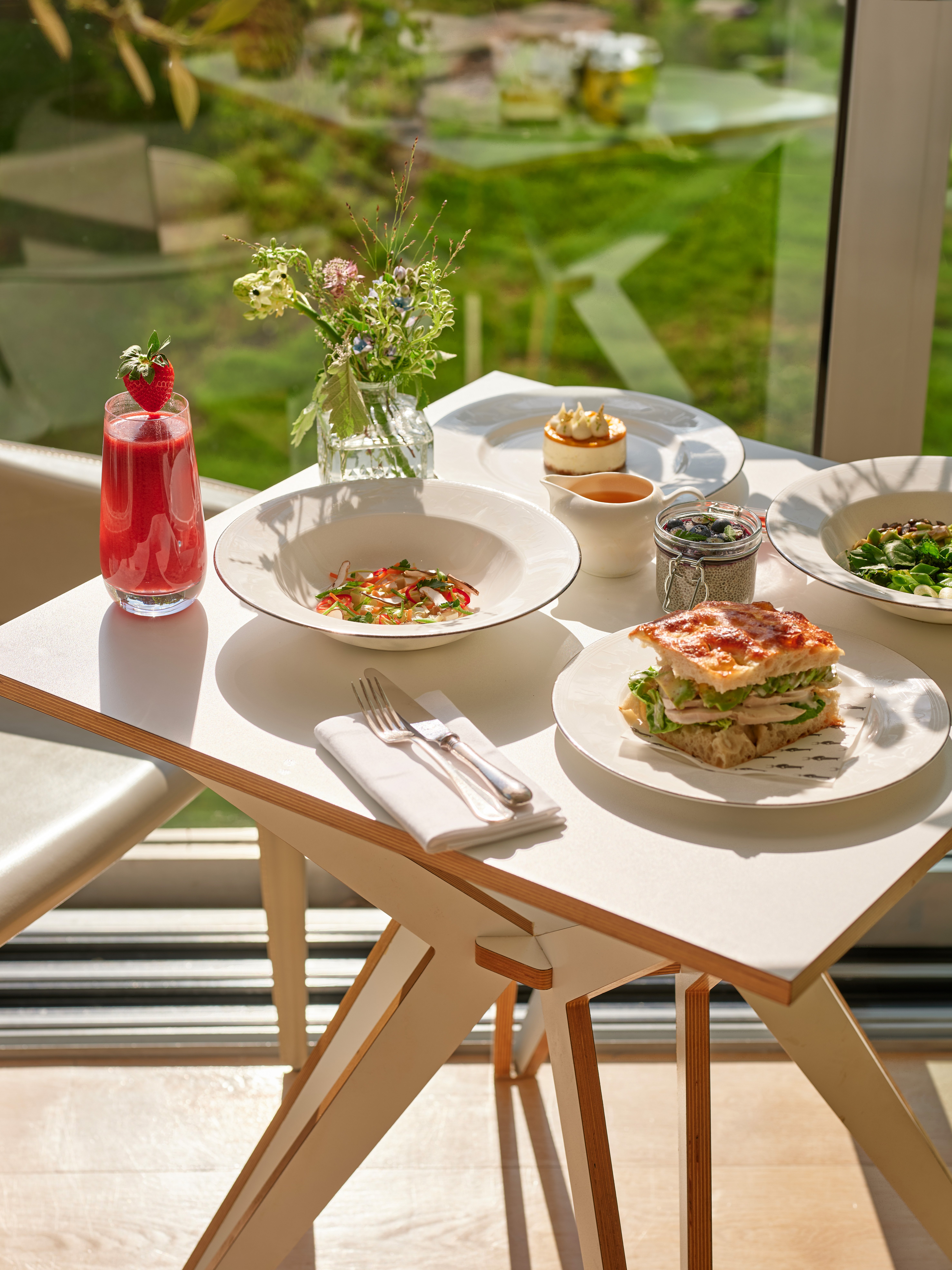 Light lunch spread with garden views at the Spa café, Coworth Park in Ascot 