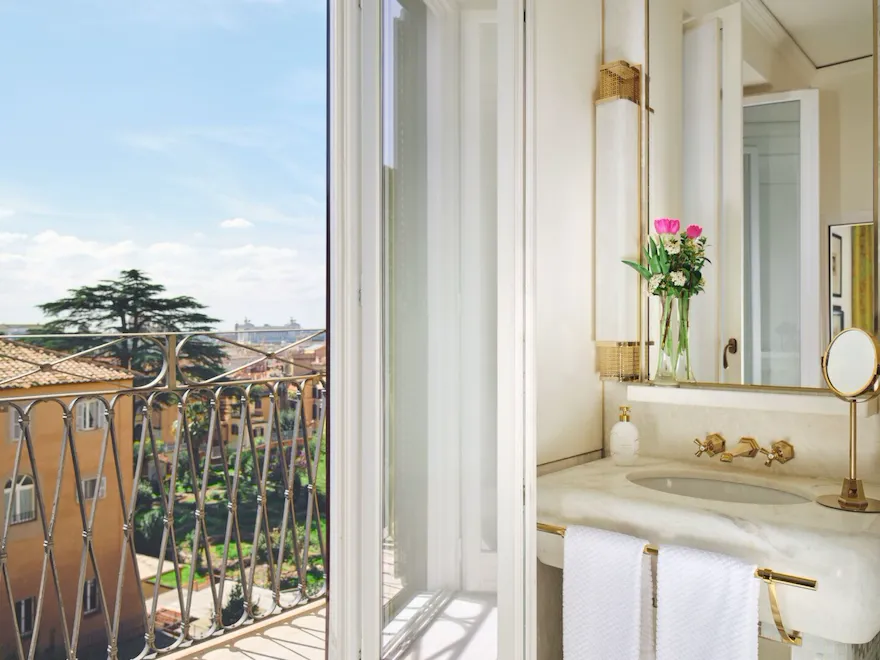 bathroom with open window on a ballcony at Hotel Eden Roma