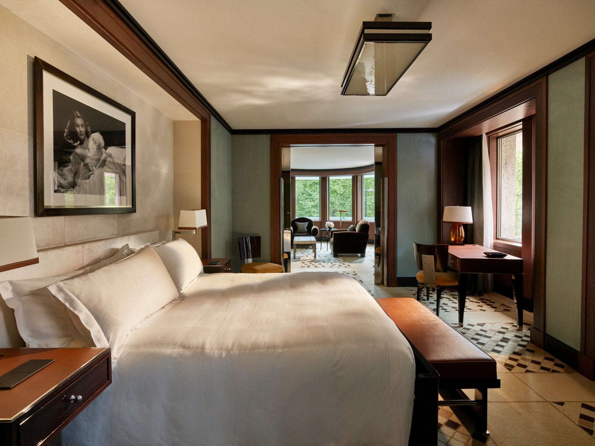 Park suite bedroom showing wrap around living room at 45 Park Lane, London