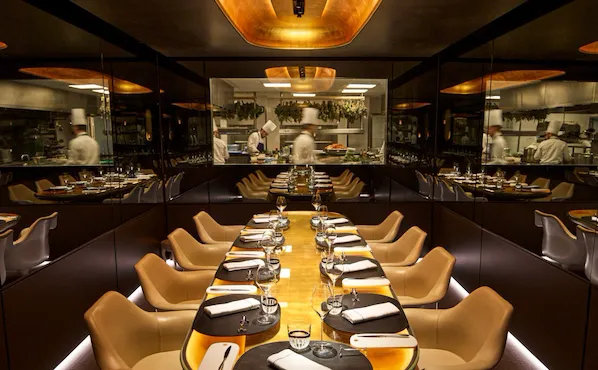 Large view of the Chef's Table with open window on the kitchen at Le Meurice, Paris - Dorchester Collection