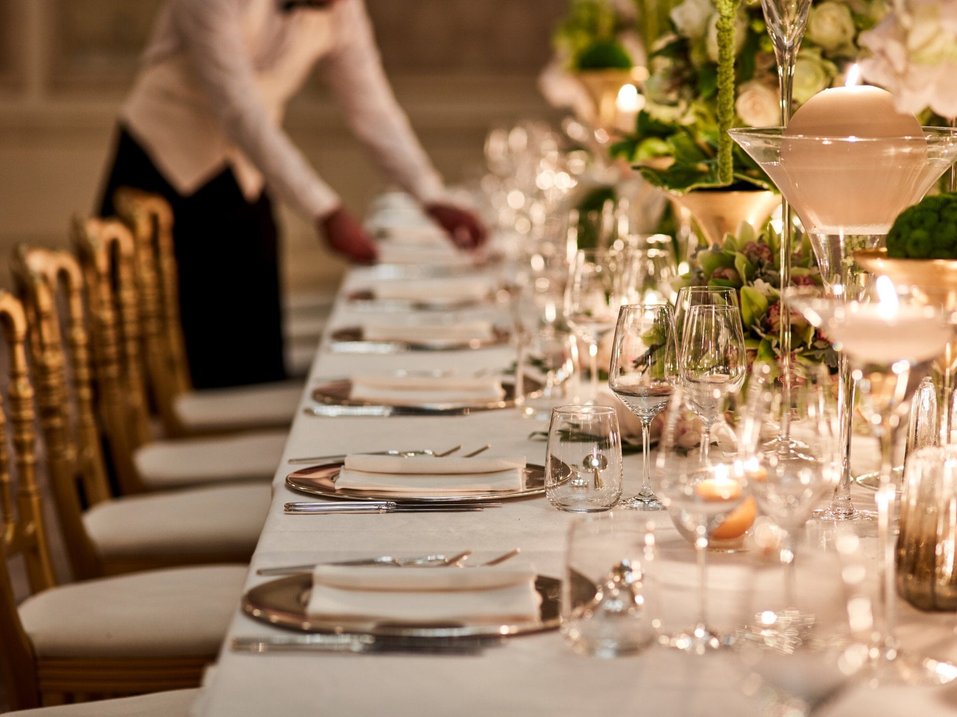Cristalli Gala Room table set up for event with waiter arranging table at Hotel Principe Di Savoia, Milan