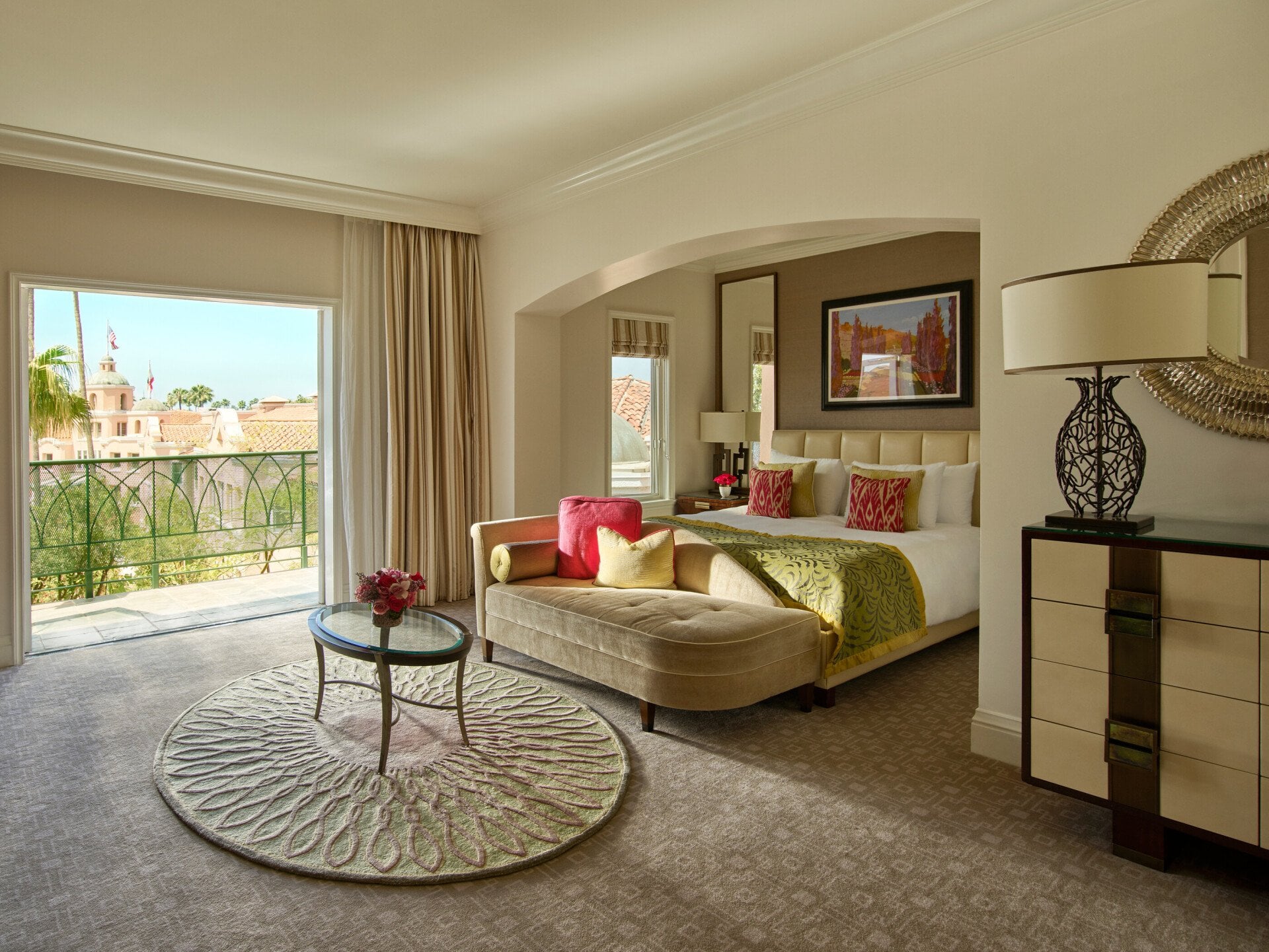 Deluxe guestroom with balcony, view of king bed and blue skies