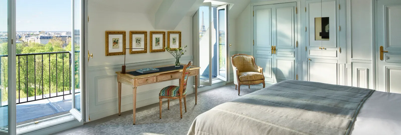 Executive room with balcony doors open to a view of the Tuileries gardens at Le Meurice, Paris