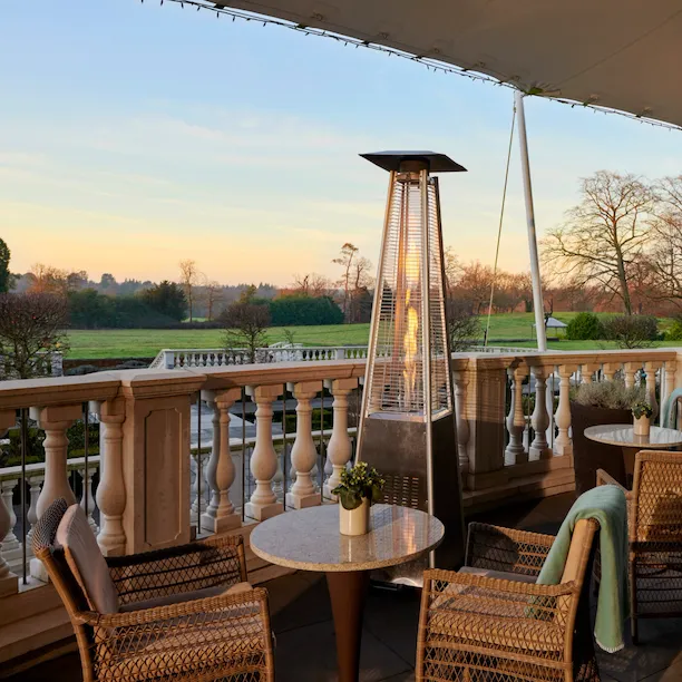Coworth Park Drawing Room terrace with views of the winter countryside
